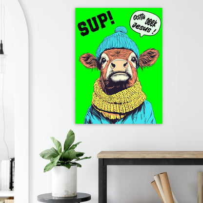 Colorful cow illustration with text on a green background, hanging above a desk.