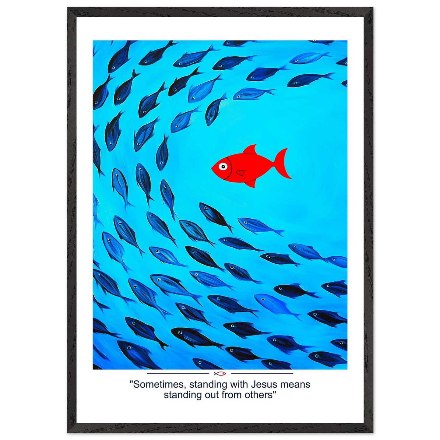 Framed Christian wall art featuring a red fish swimming in water with blue fish, and the text 'Sometimes standing with Jesus means standing out from others' as a quote.