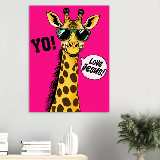 A colorful poster featuring a giraffe with sunglasses and a speech bubble that reads 'LOVE JESUS', set against a bold pink background displayed on a minimalist white wall above a console with books, ceramic vases, and a green plant