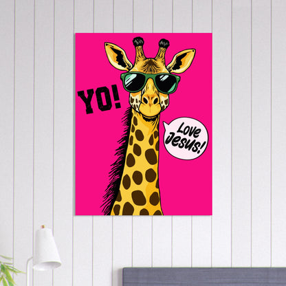 A colorful poster featuring a giraffe with sunglasses and a speech bubble that reads 'LOVE JESUS', set against a bold pink background displayed on a white paneled wall above a bed with a modern lamp nearby