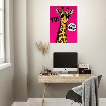 A colorful poster featuring a giraffe with sunglasses and a speech bubble that reads 'LOVE JESUS', set against a bold pink background displayed above a modern home office desk setup