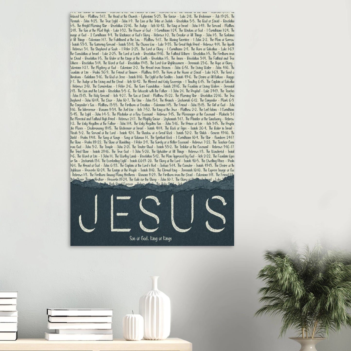 christian canvas wall art featuring the name jesus in large letters with scriptural titles above displayed in a modern living room above a wooden shelf with minimalist decor