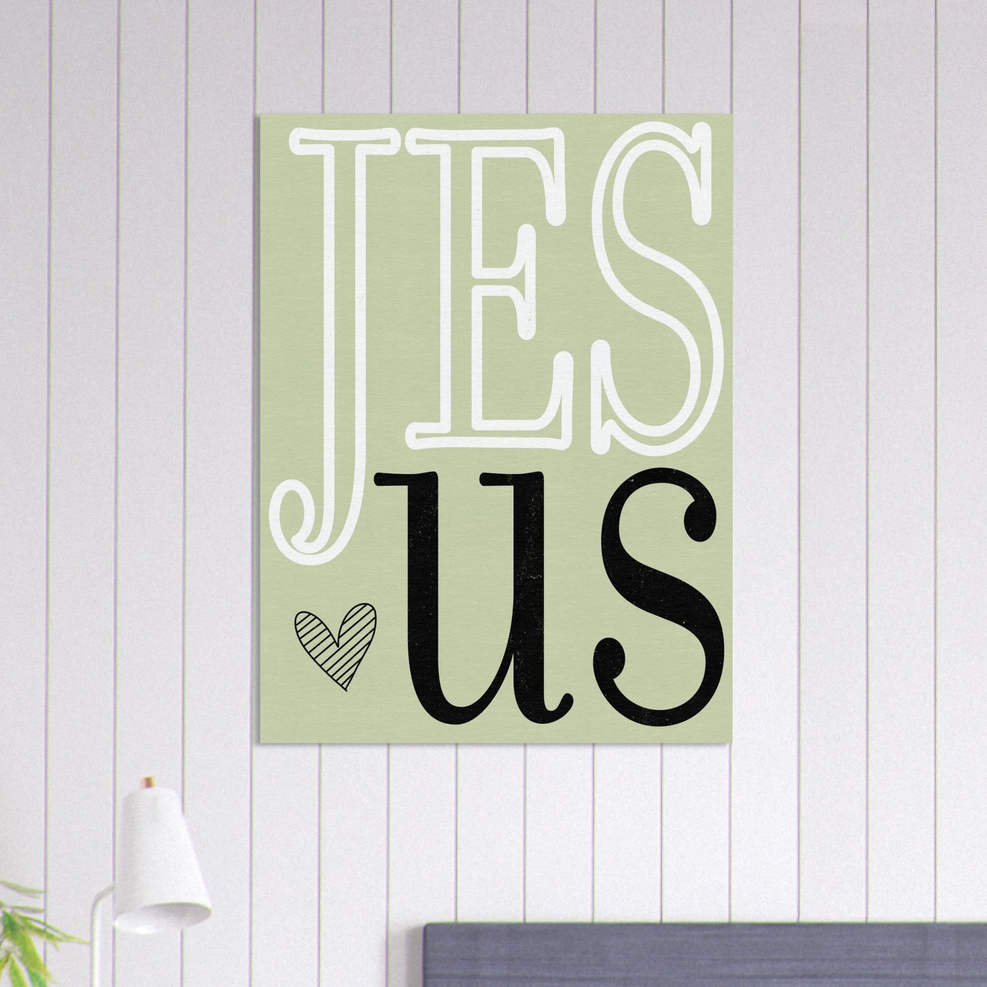 Decorative sign with 'Jesus' on a light green background