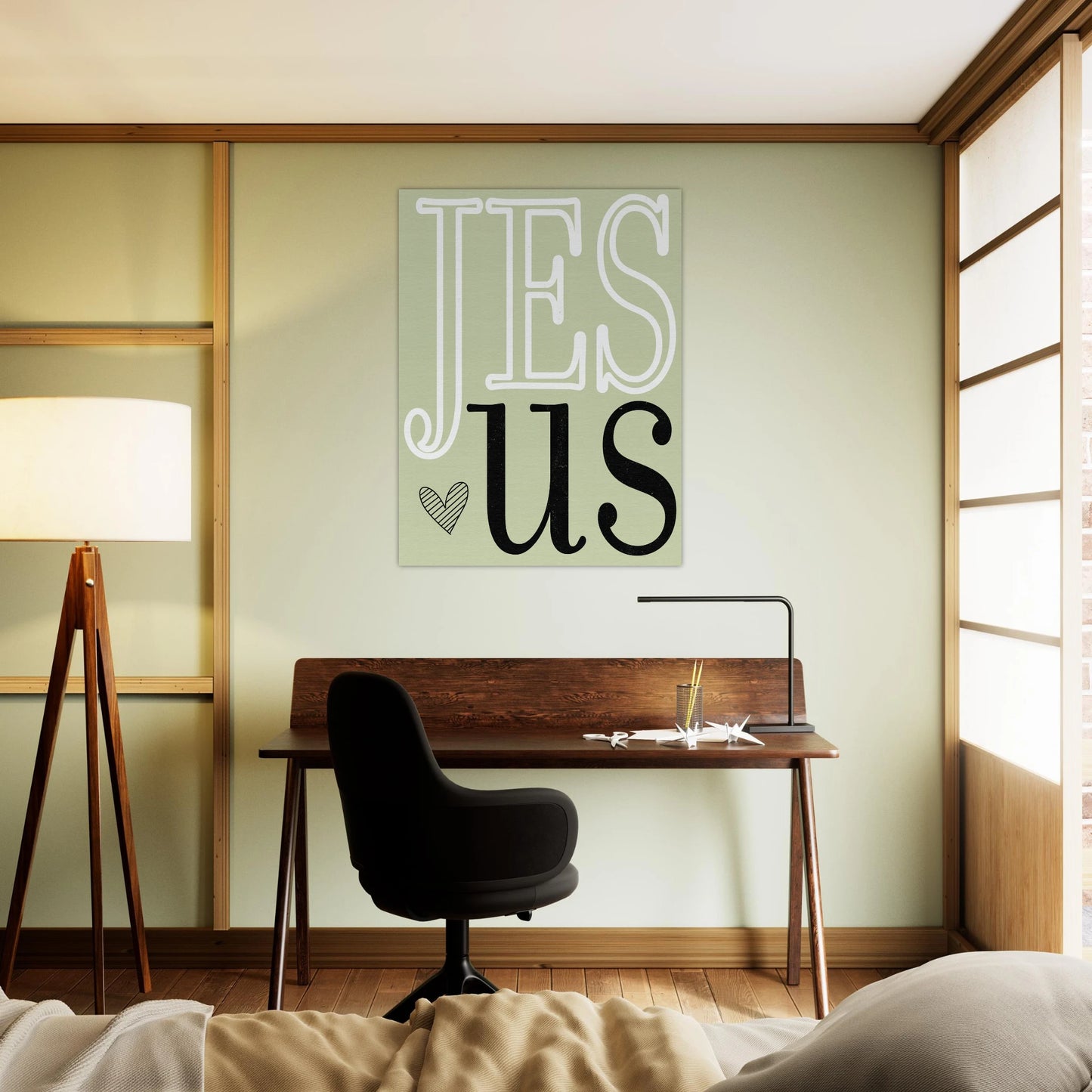 Modern room with desk, chair, and 'Jesus' wall art
