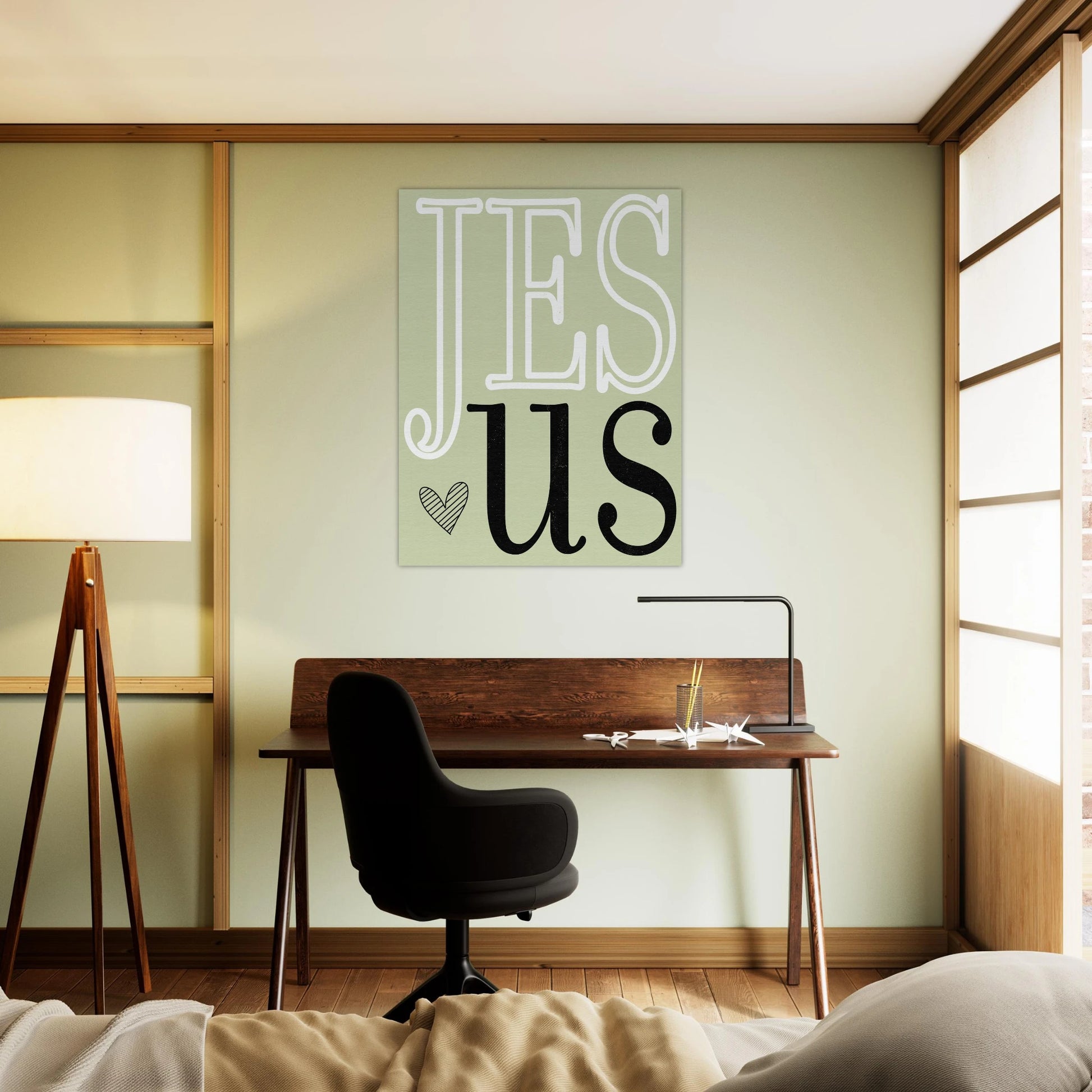 Modern room with desk, chair, and 'Jesus' wall art