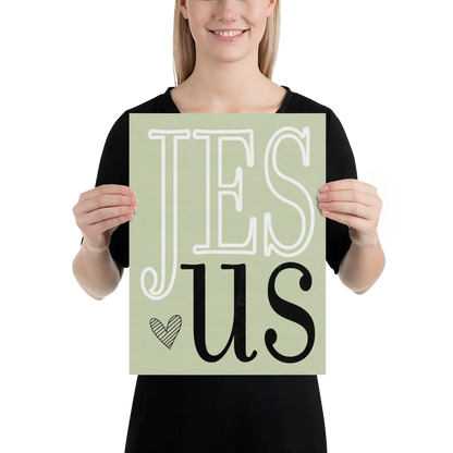 Person holding a sign with 'Jesus' on a light green background