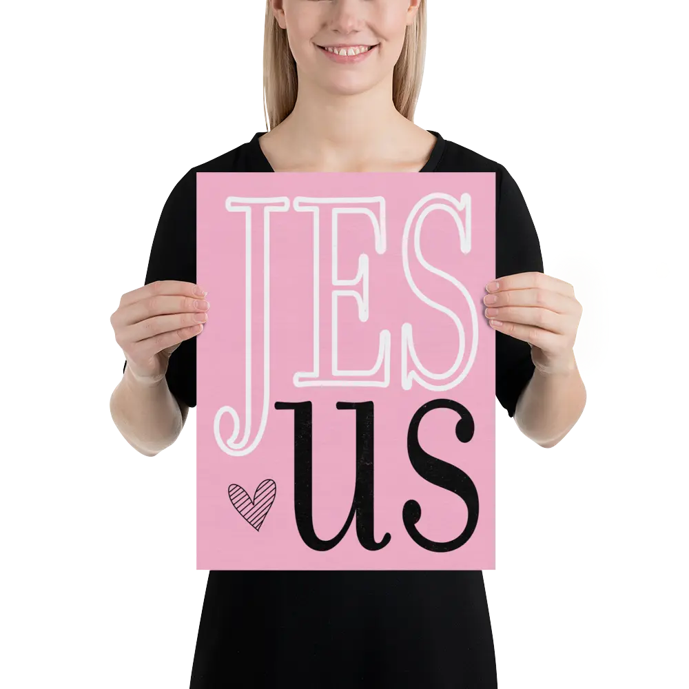 Person holding a pink sign with 'JESUS' text