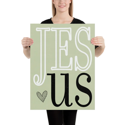 Person holding a sign with 'Jesus' on a light green background