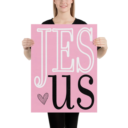 Person holding a pink sign with 'JESUS' text
