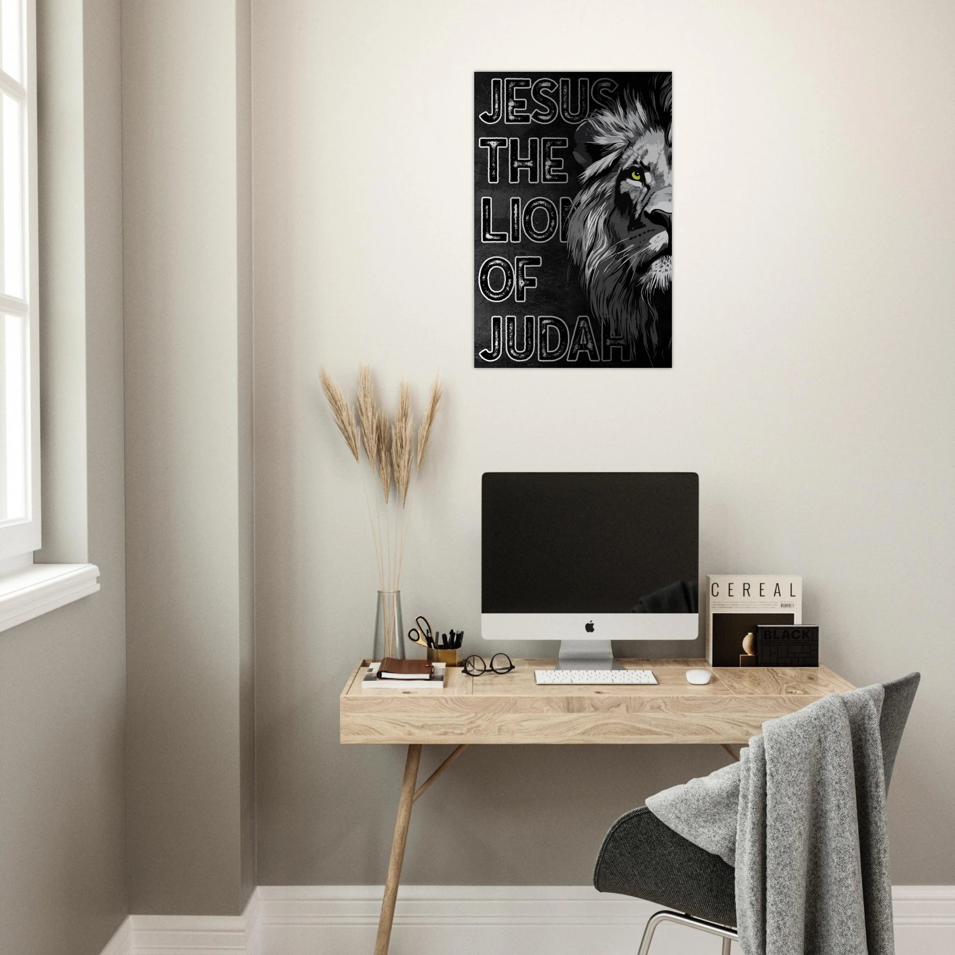 Modern home office with a desk, computer, and 'Jesus the Lion of Judah' poster on the wall.
