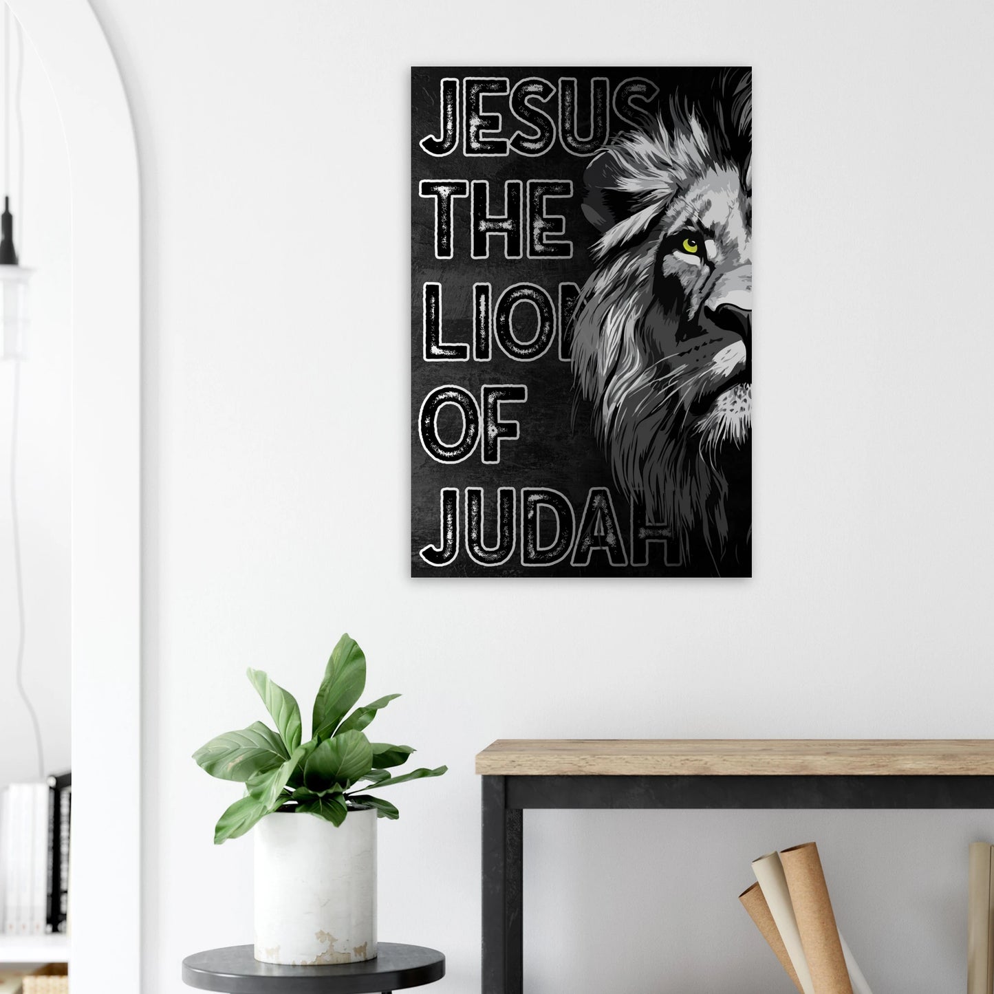 Canvas print with 'Jesus the Lion of Judah' design on a wall above a desk.