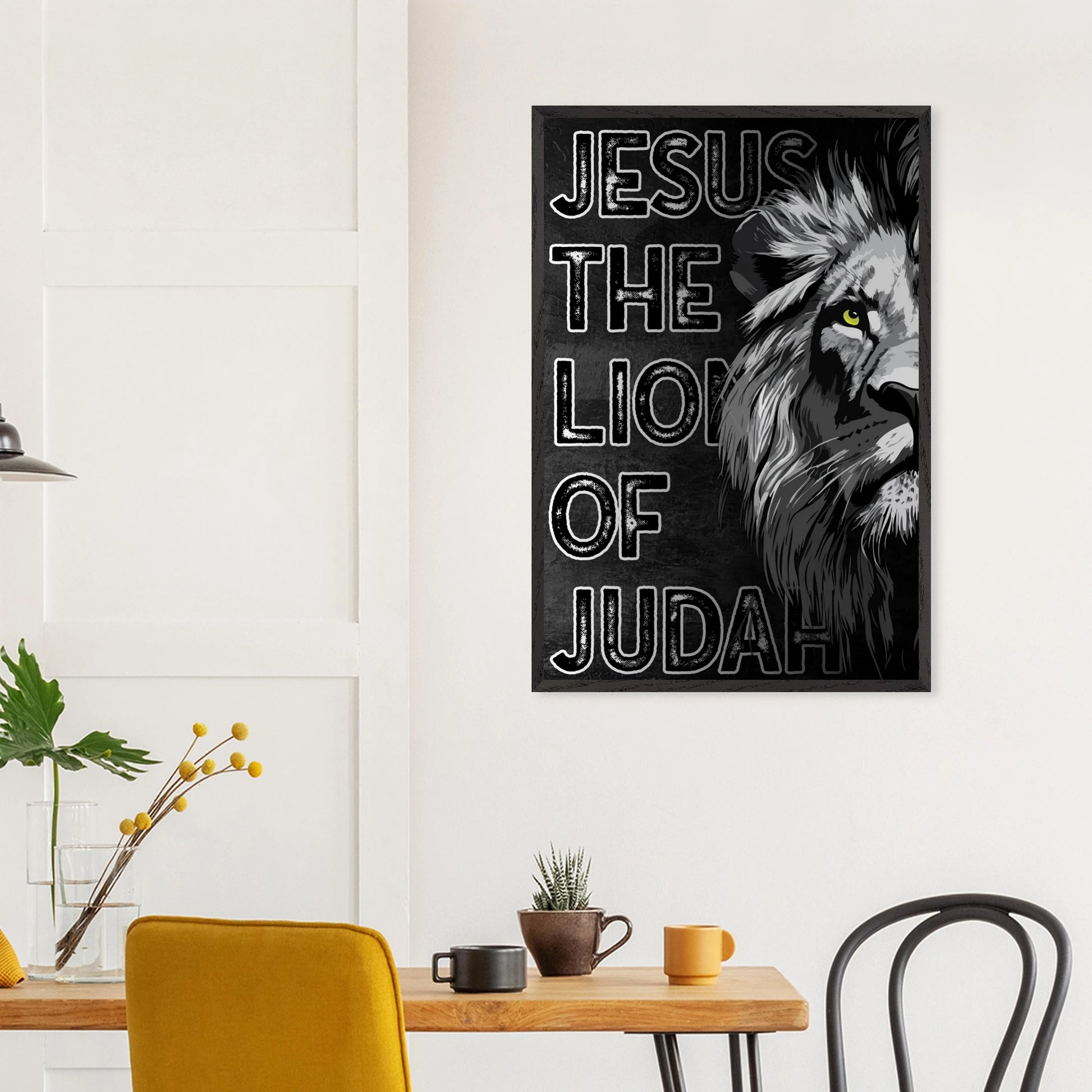 Poster with a lion and text 'Jesus the Lion of Judah' on a wall above a table with decor items.