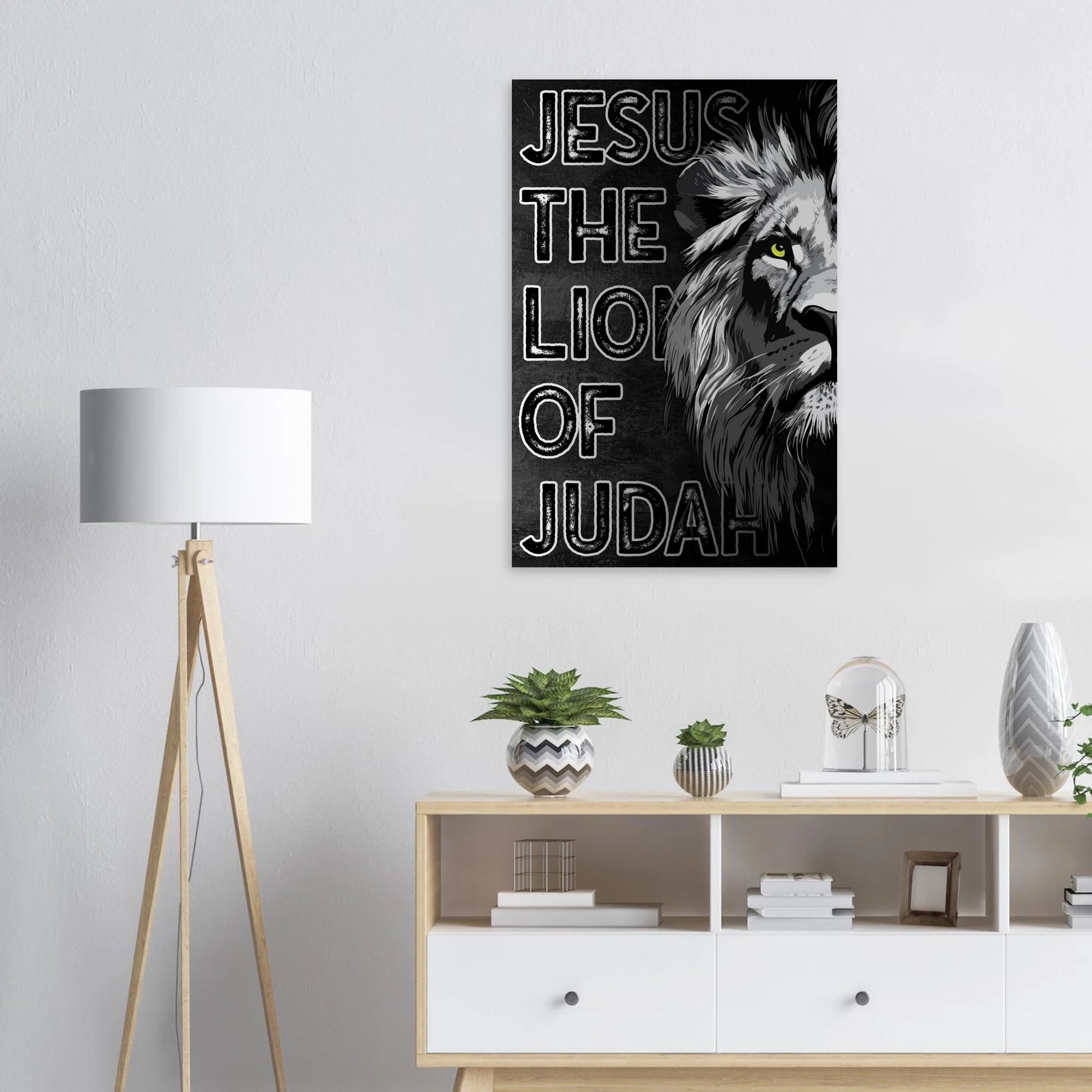 Poster with 'Jesus the Lion of Judah' design on a wall above a wooden cabinet with decorative items.