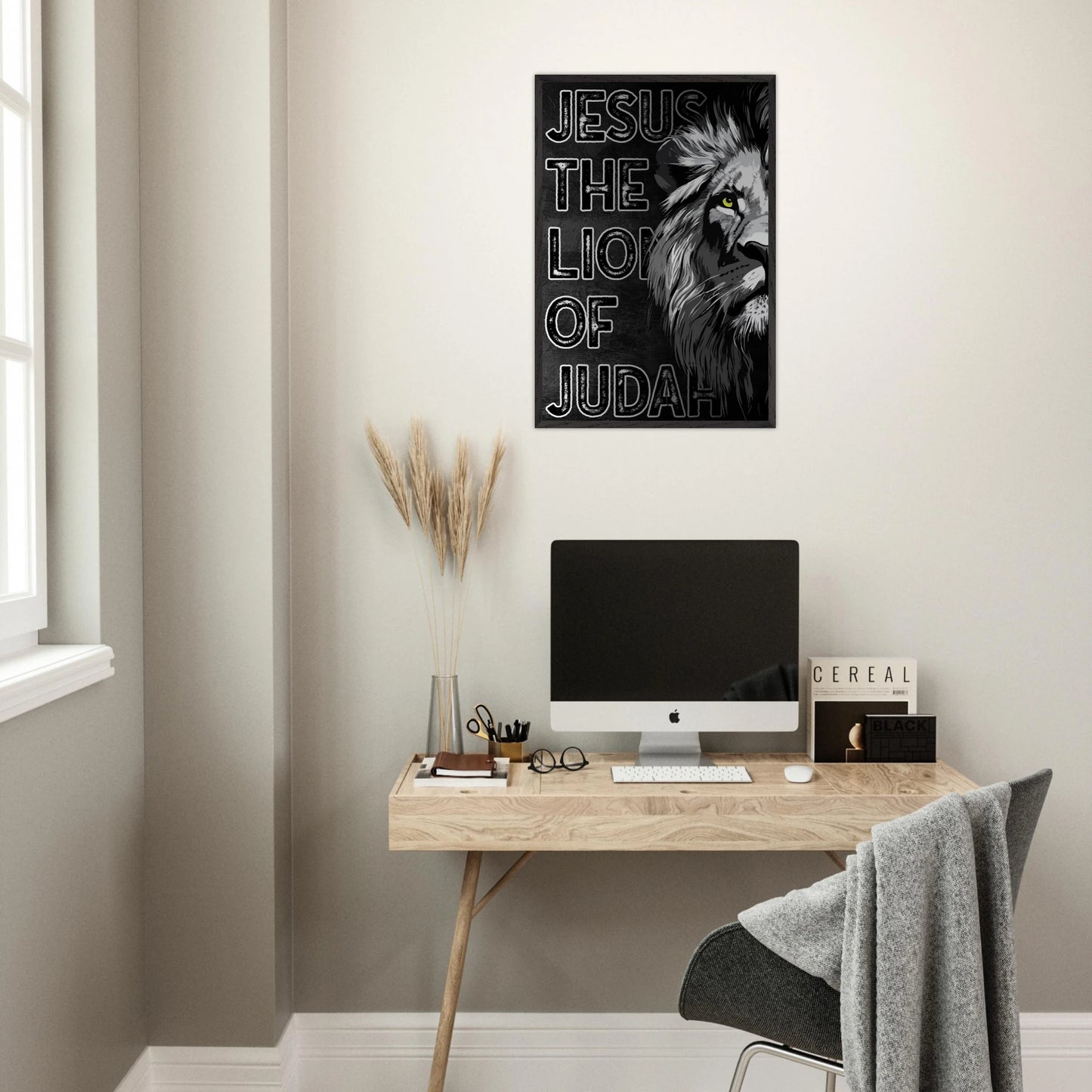 Modern home office with a desk, computer, and 'Jesus the Lion of Judah' poster on the wall.