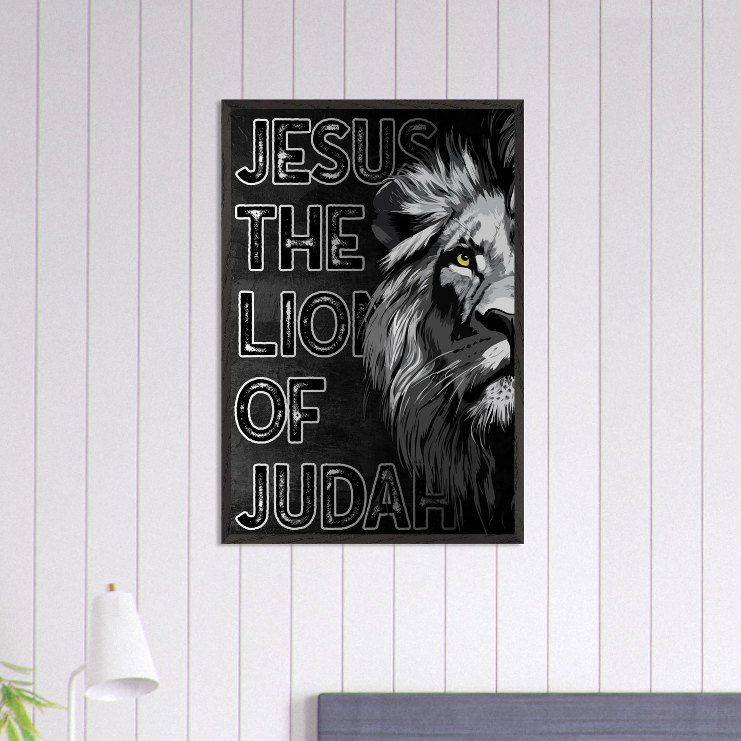 Poster with a lion's head and 'Jesus, The Lion of Judah' text on a white wall.