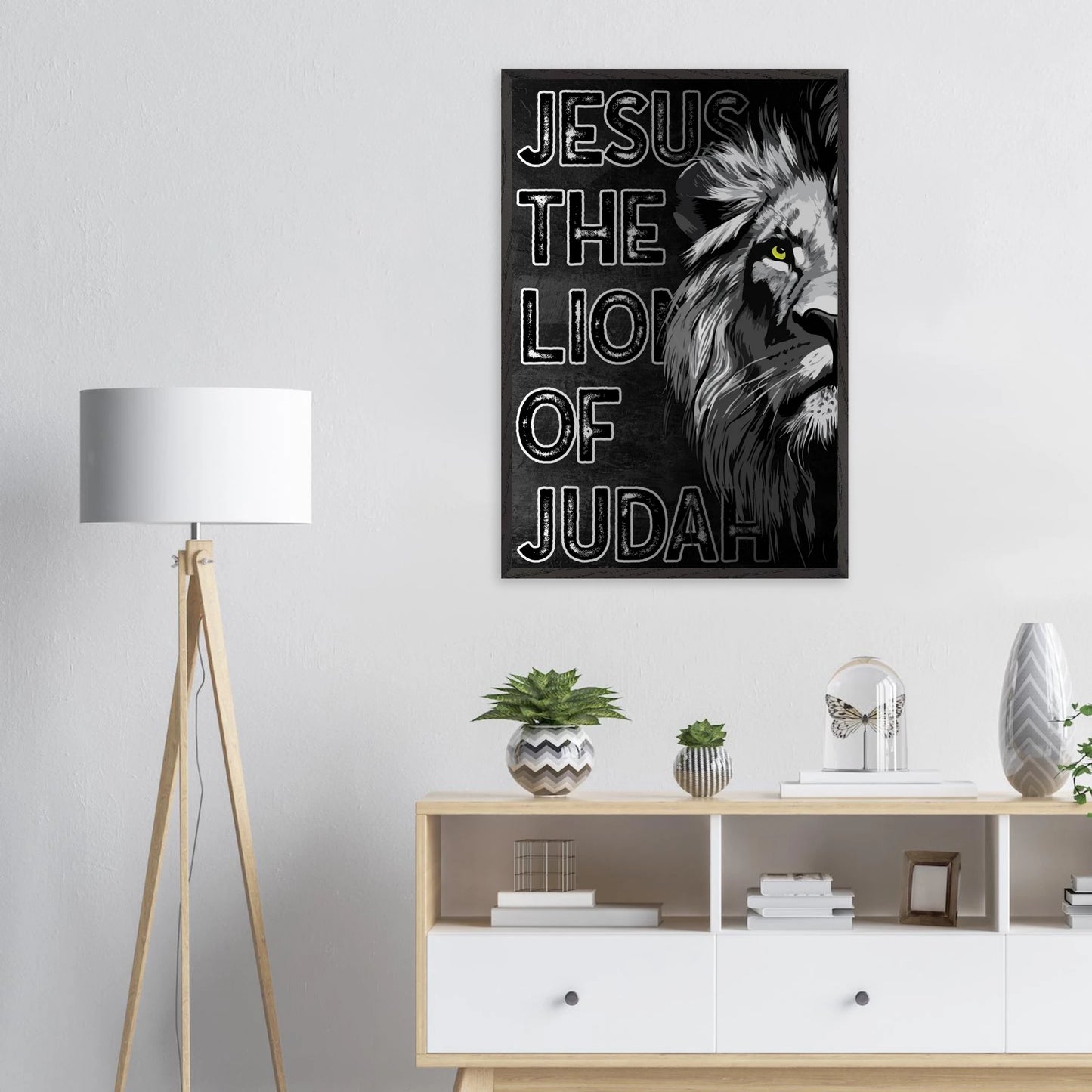 Poster of a lion with 'Jesus the Lion of Judah' text in a modern living room.