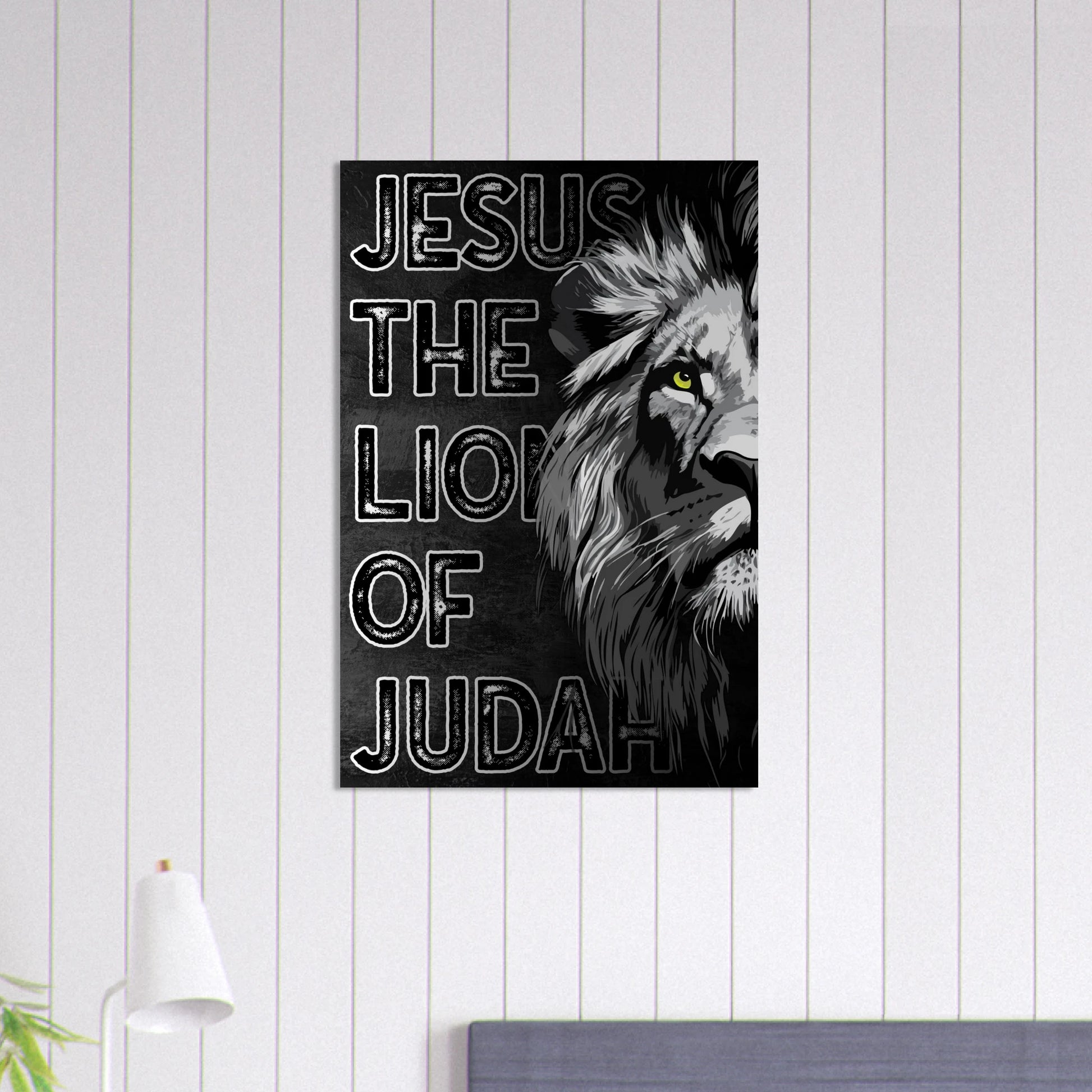 Canvas print with a lion's head and 'Jesus, The Lion of Judah' text on a white wall.