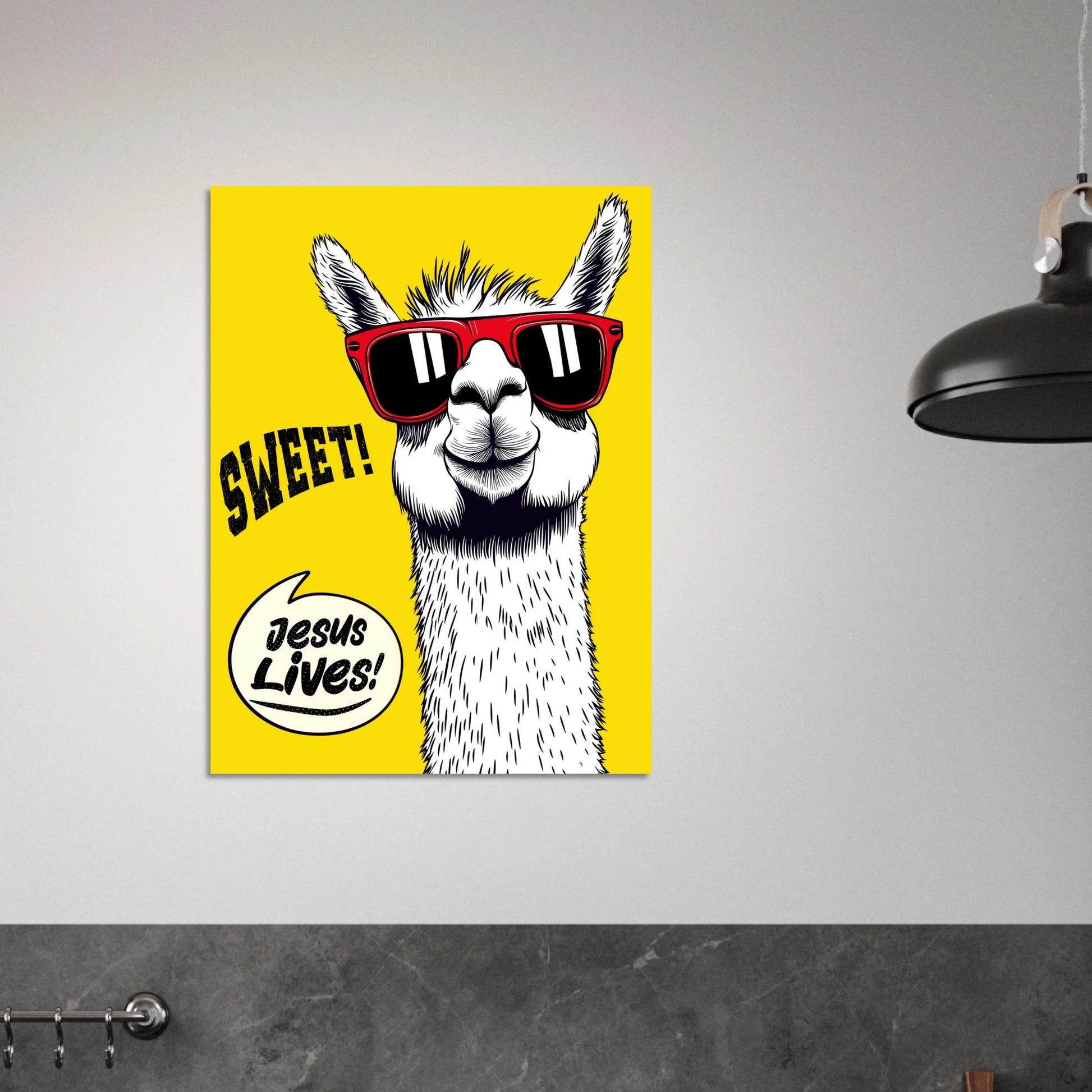 Yellow ‘Jesus Lives’ llama poster framed as wall art in a bright minimalist room.