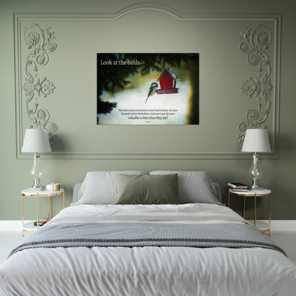 Bedroom with a decorative headboard featuring a framed picture of birds and a red birdhouse.