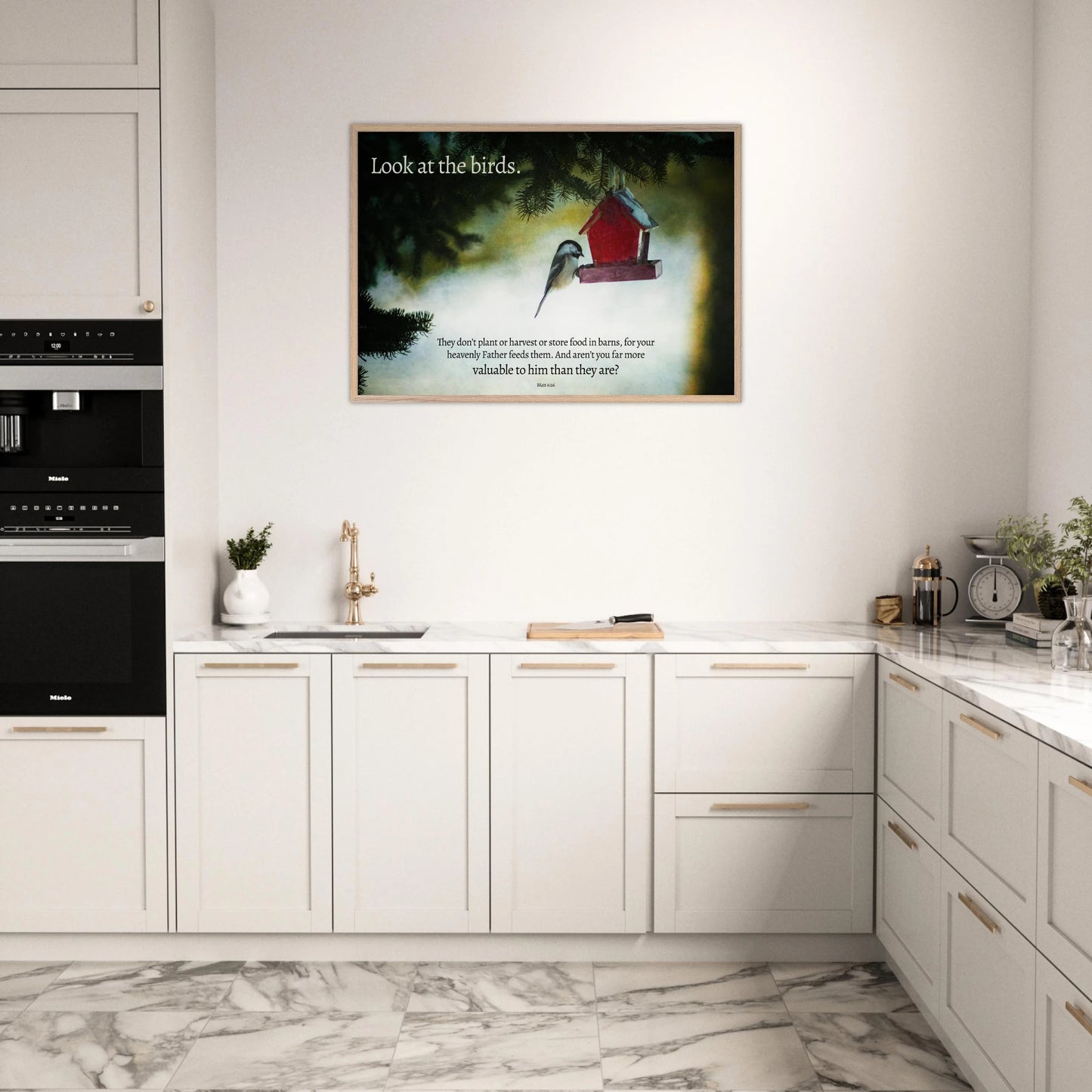 Modern kitchen with a framed picture of a red birdhouse on the wall.