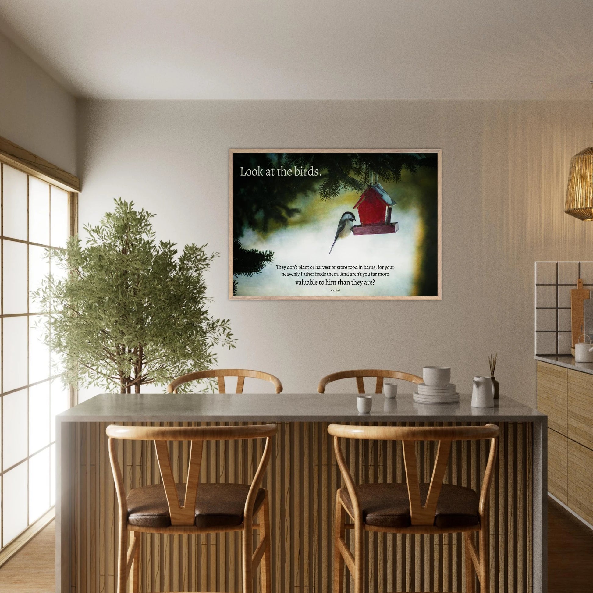 Dining room with a framed picture of birds and a red birdhouse on the wall.