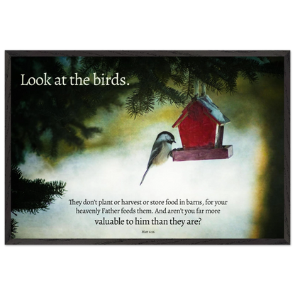 Red birdhouse with a bird on a misty background, featuring a quote.