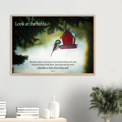 Framed artwork with a bird and birdhouse on a wall, featuring a quote.