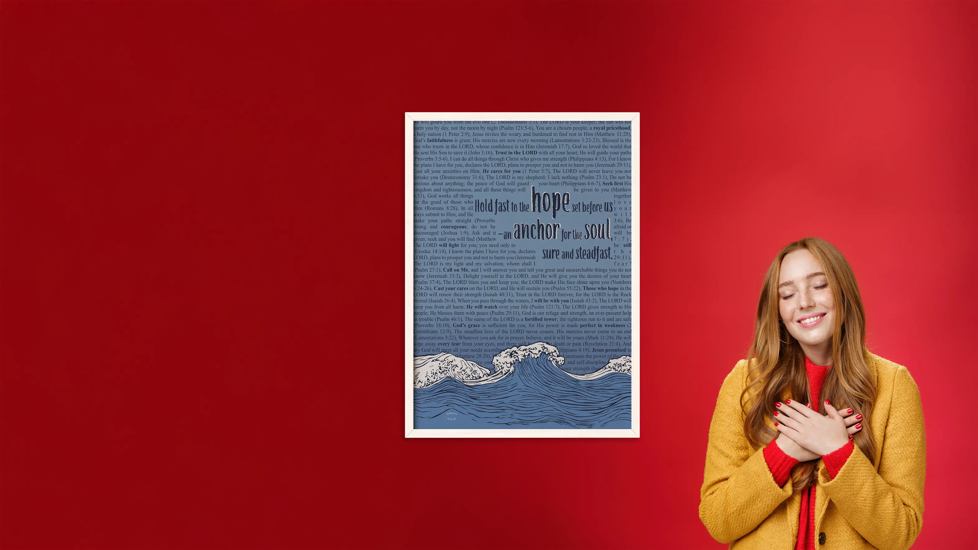 Woman standing next to a framed artwork on a red background