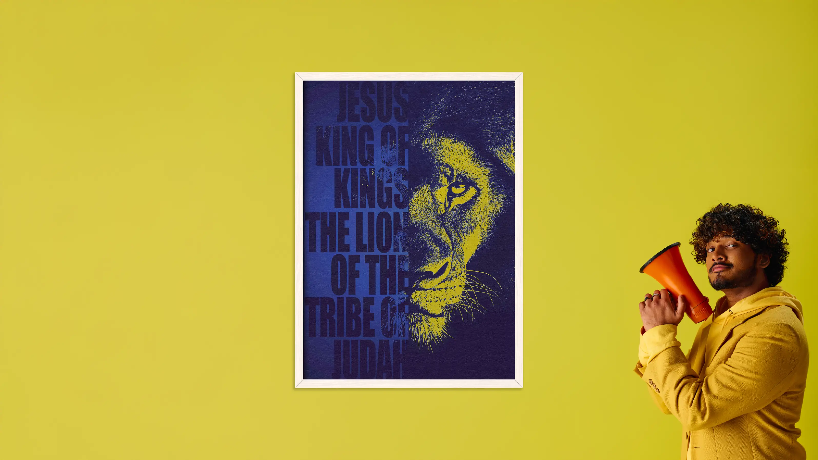 Man holding a megaphone next to a poster of a lion's face with text on a yellow background