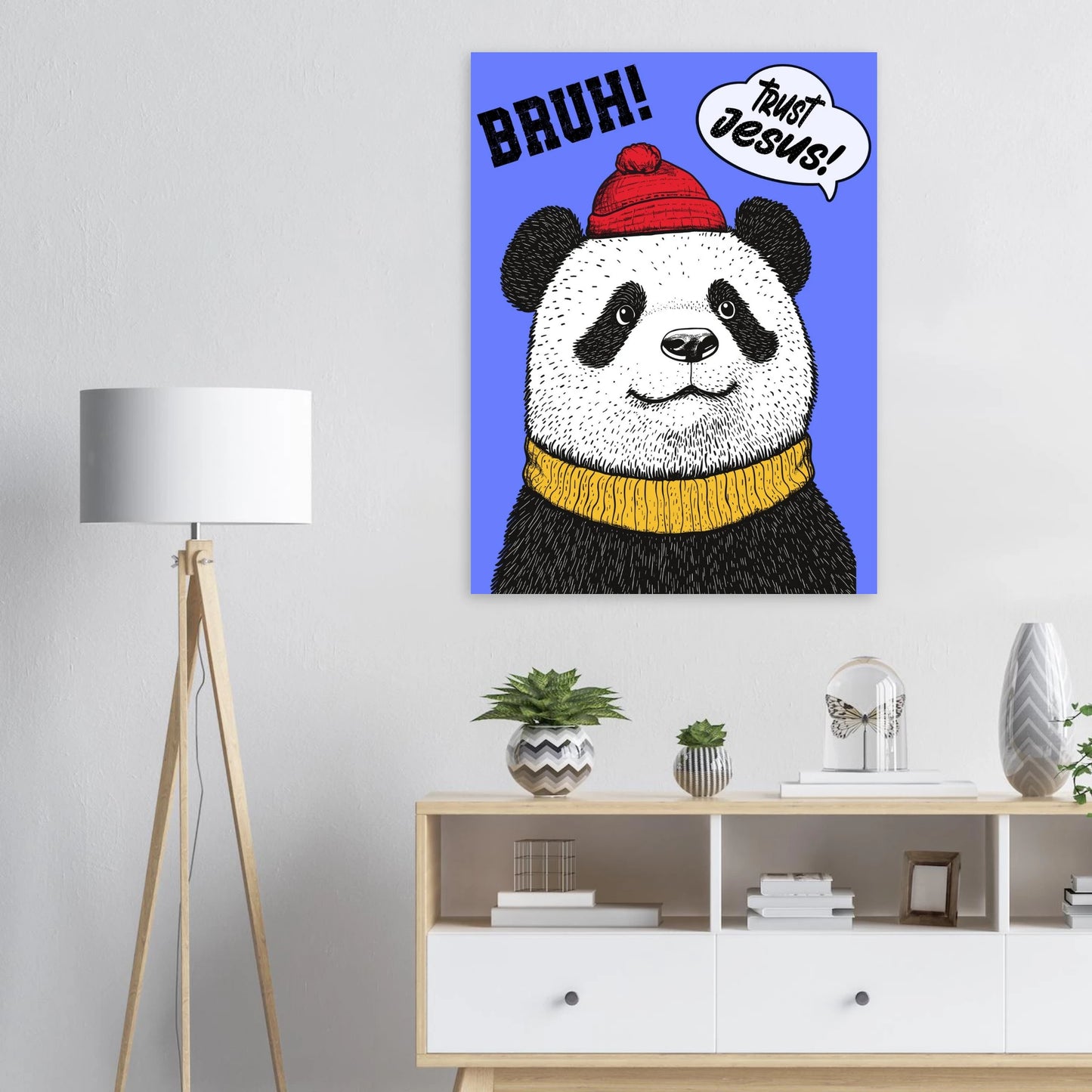 Trust Jesus panda artwork displayed above a dresser with a floor lamp and small plants