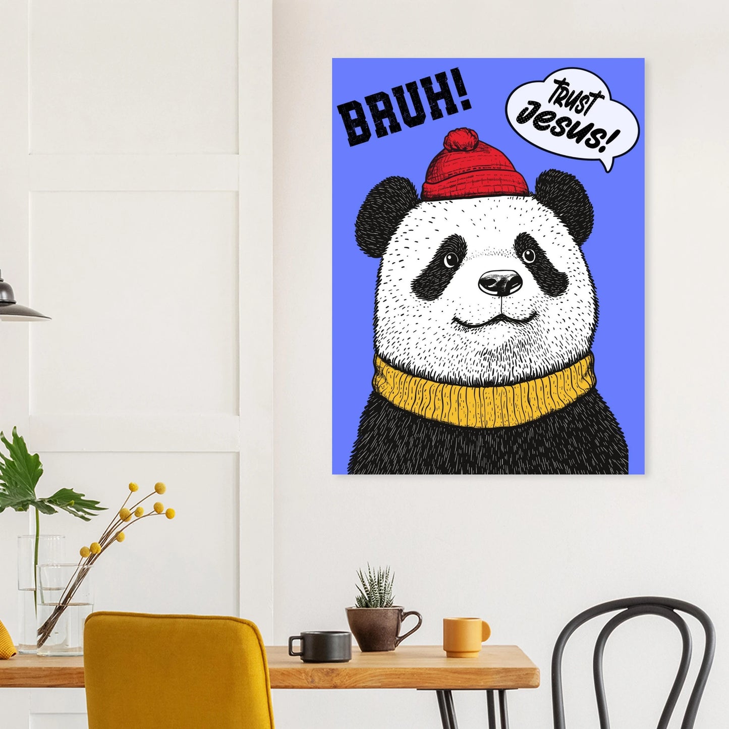 Cute panda Trust Jesus poster hanging above a small dining table and yellow chair