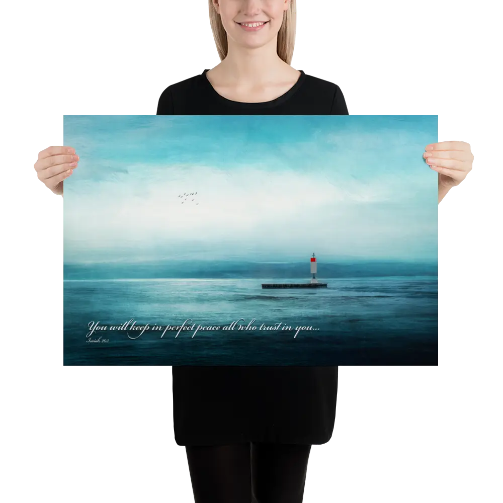 Person holding a large poster of a lighthouse over water with a quote.