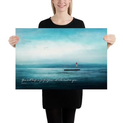 Person holding a large poster of a lighthouse over water with a quote.