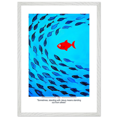 Framed Christian wall art featuring a red fish swimming in water with blue fish, and the text 'Sometimes standing with Jesus means standing out from others' as a quote.