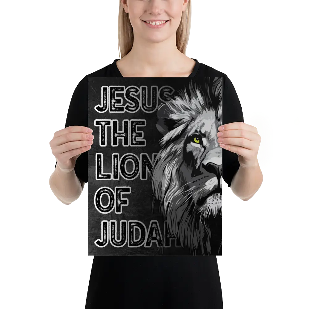 Person holding a black t-shirt with a lion graphic and text.