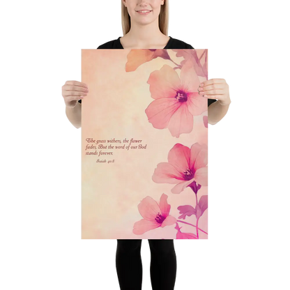 Person holding a large floral poster with pink flowers and text.