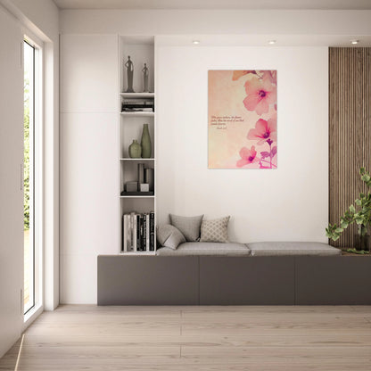 Modern living room with a gray sofa, bookshelf, and floral artwork.