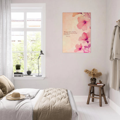 Bedroom with floral artwork on the wall, window, and small table with decor items.
