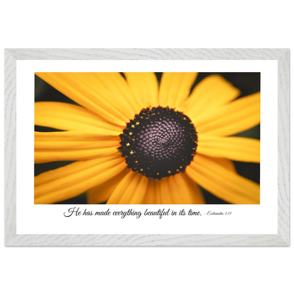 A framed art print of a close-up yellow flower with a quote from Ecclesiastes 3:11, 'He has made everything beautiful in its time.'.
