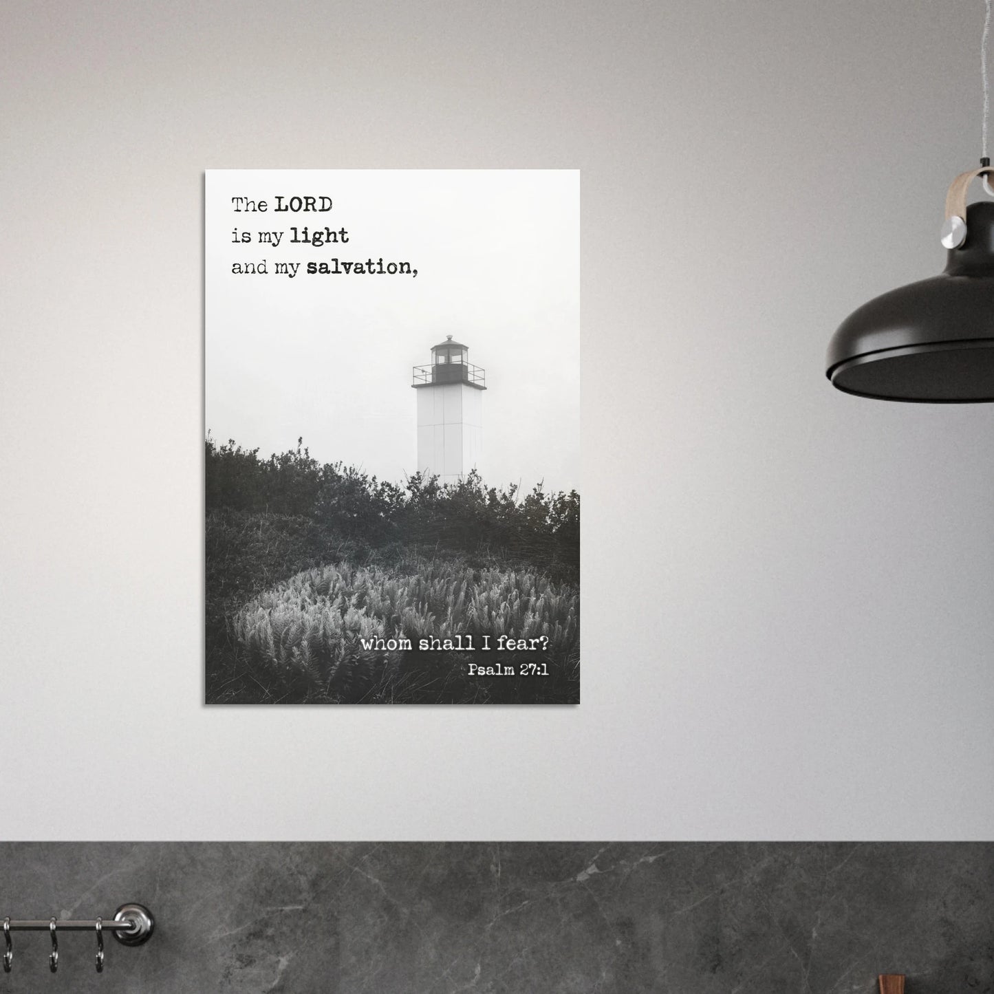 Poster with a lighthouse and Bible verse on a gray wall.