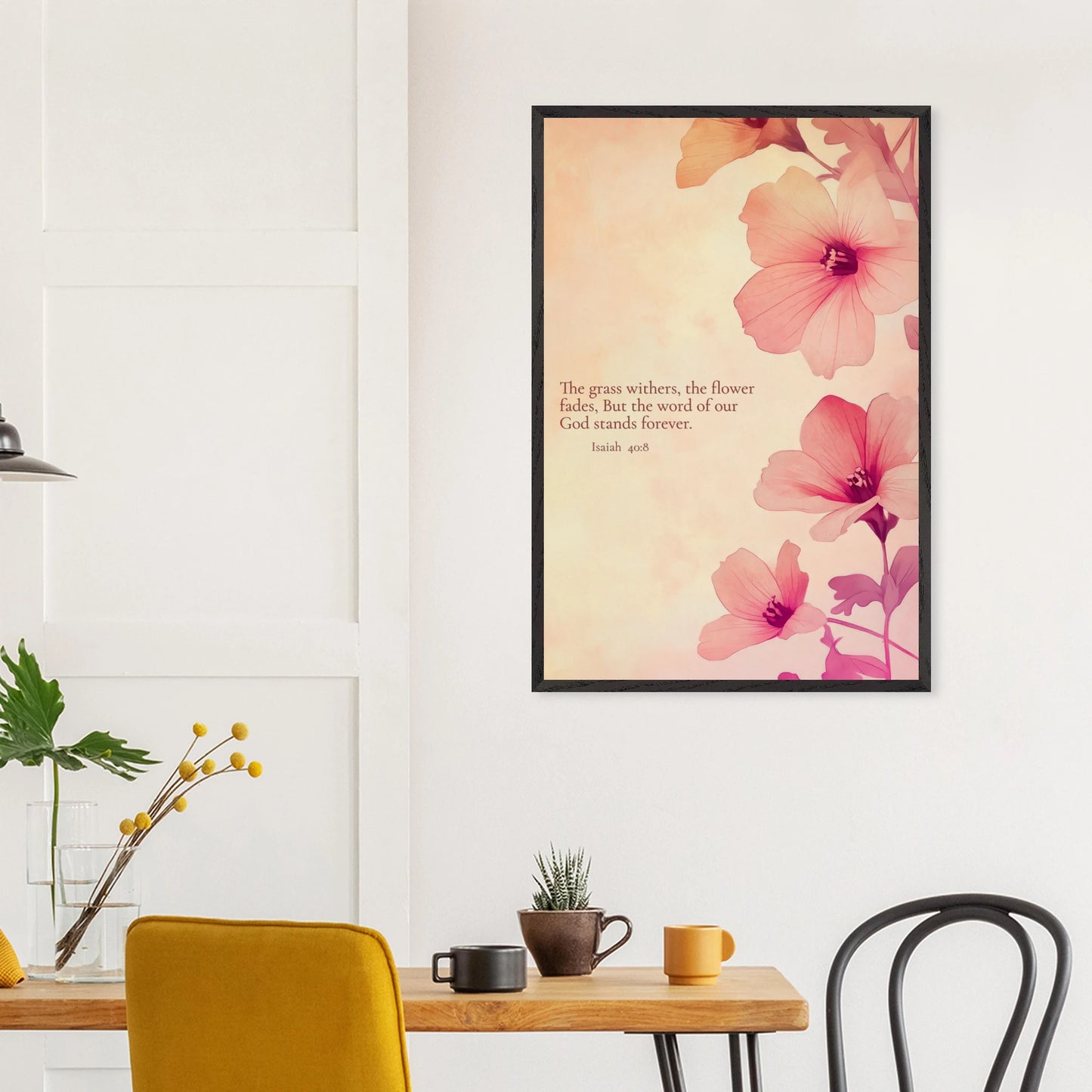 Framed floral Scripture print featuring Isaiah 40:8 hanging above a dining table with yellow chairs in a cozy kitchen setting.