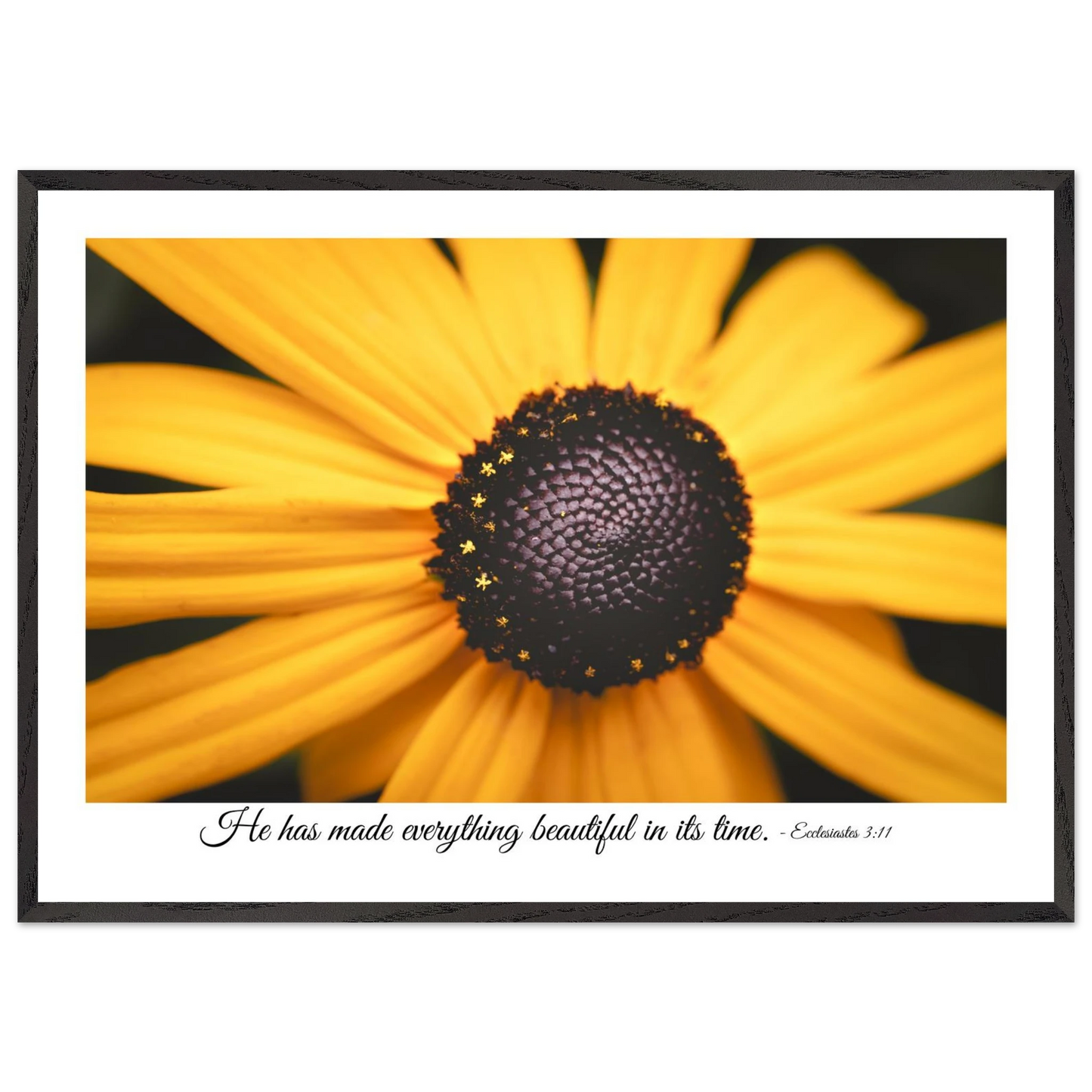 A framed art print of a close-up yellow flower with a quote from Ecclesiastes 3:11, 'He has made everything beautiful in its time.'.