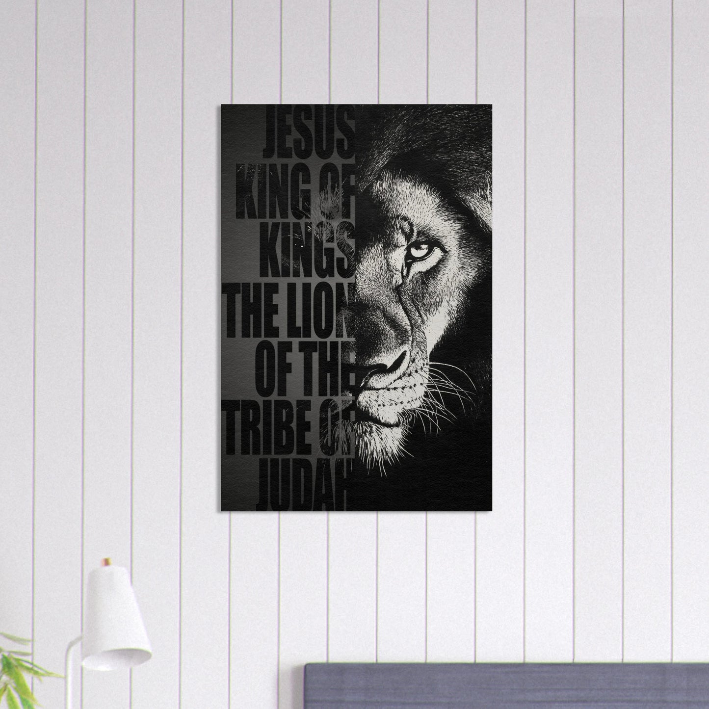 Black and white Lion of Judah Christian wall art featuring a powerful lion portrait with the words Jesus King of Kings Lion of the Tribe of Judah displayed in a bright modern minimalist interior