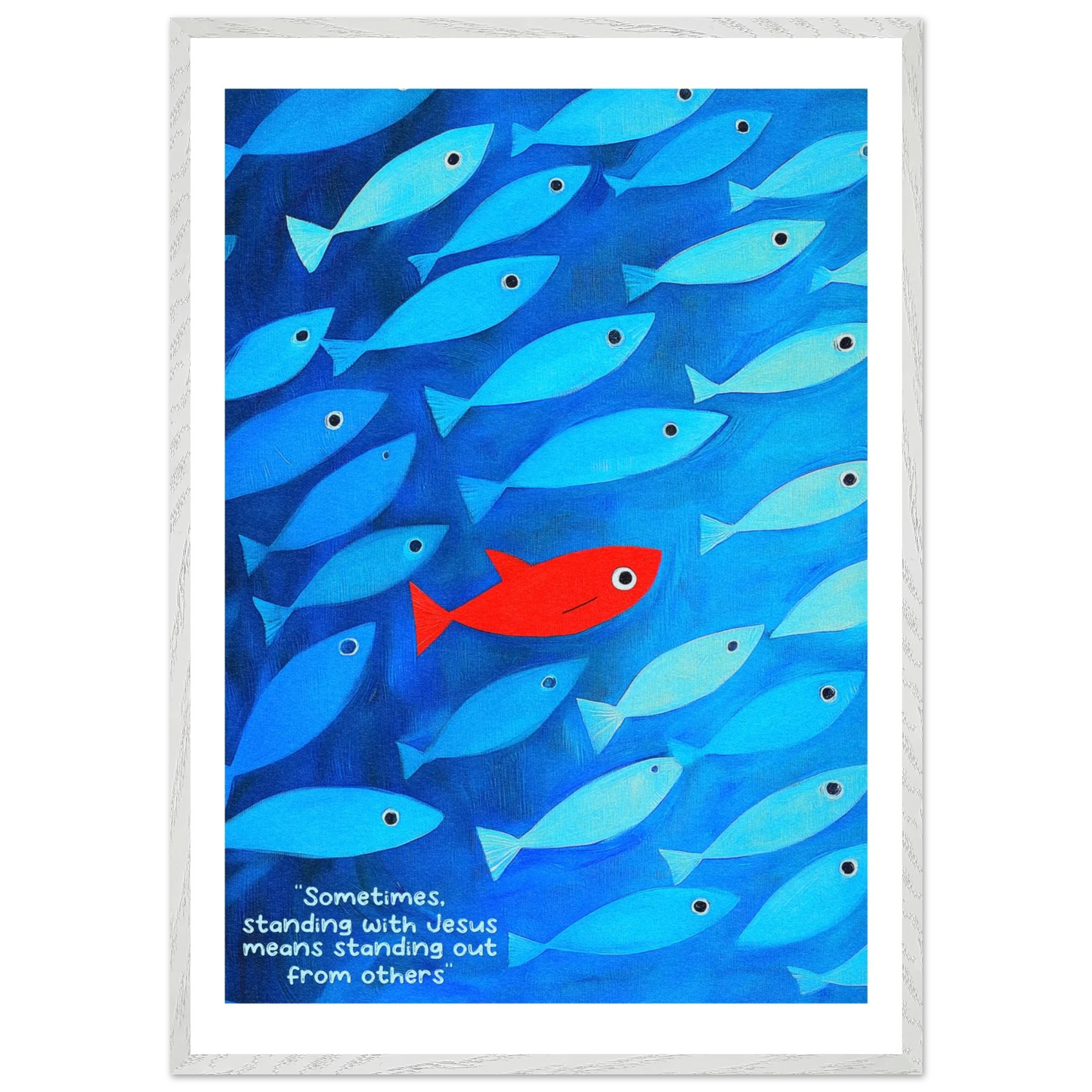 Framed wall art featuring a school of blue fish with a single red fish, and text that reads: 'Sometimes standing with Jesus means standing out from others.'.