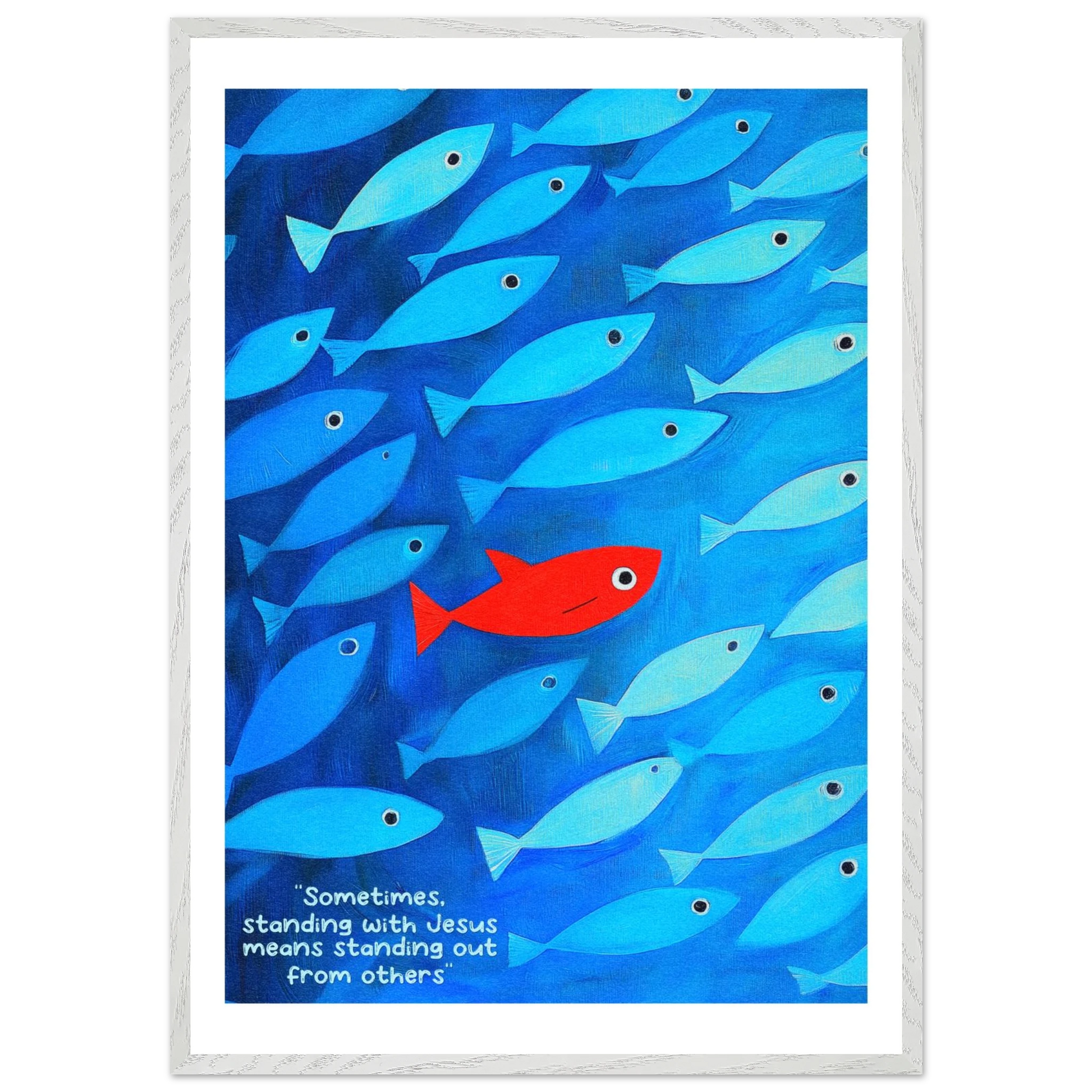 Framed wall art featuring a school of blue fish with a single red fish, and text that reads: 'Sometimes standing with Jesus means standing out from others.'.