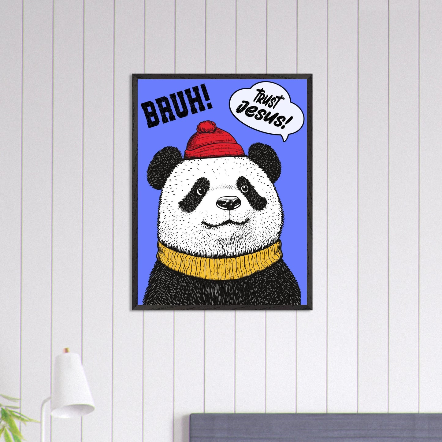 Playful Christian wall art illustration of a panda wearing a red beanie and yellow sweater on a blue background with the words BRUH and Trust Jesus in speech bubbles displayed n a bright minimalist bedroom setting
