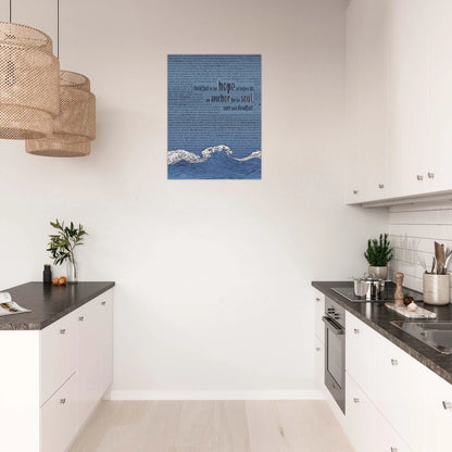 christian metal artwork featuring waves, an anchor, and bible verses in pink and silver hanging in a modern white kitchen