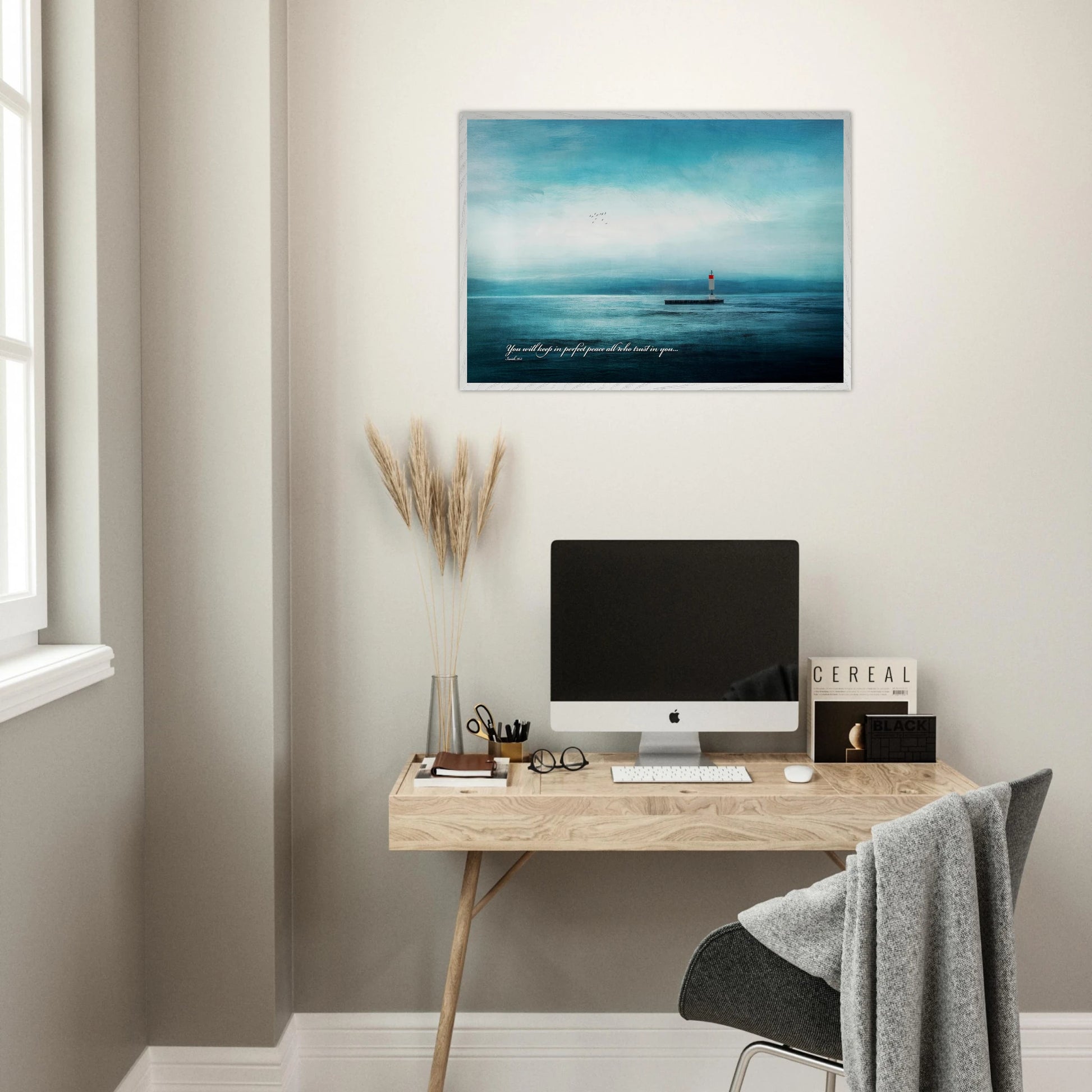 blue ocean lighthouse christian art hanging above contemporary home office desk