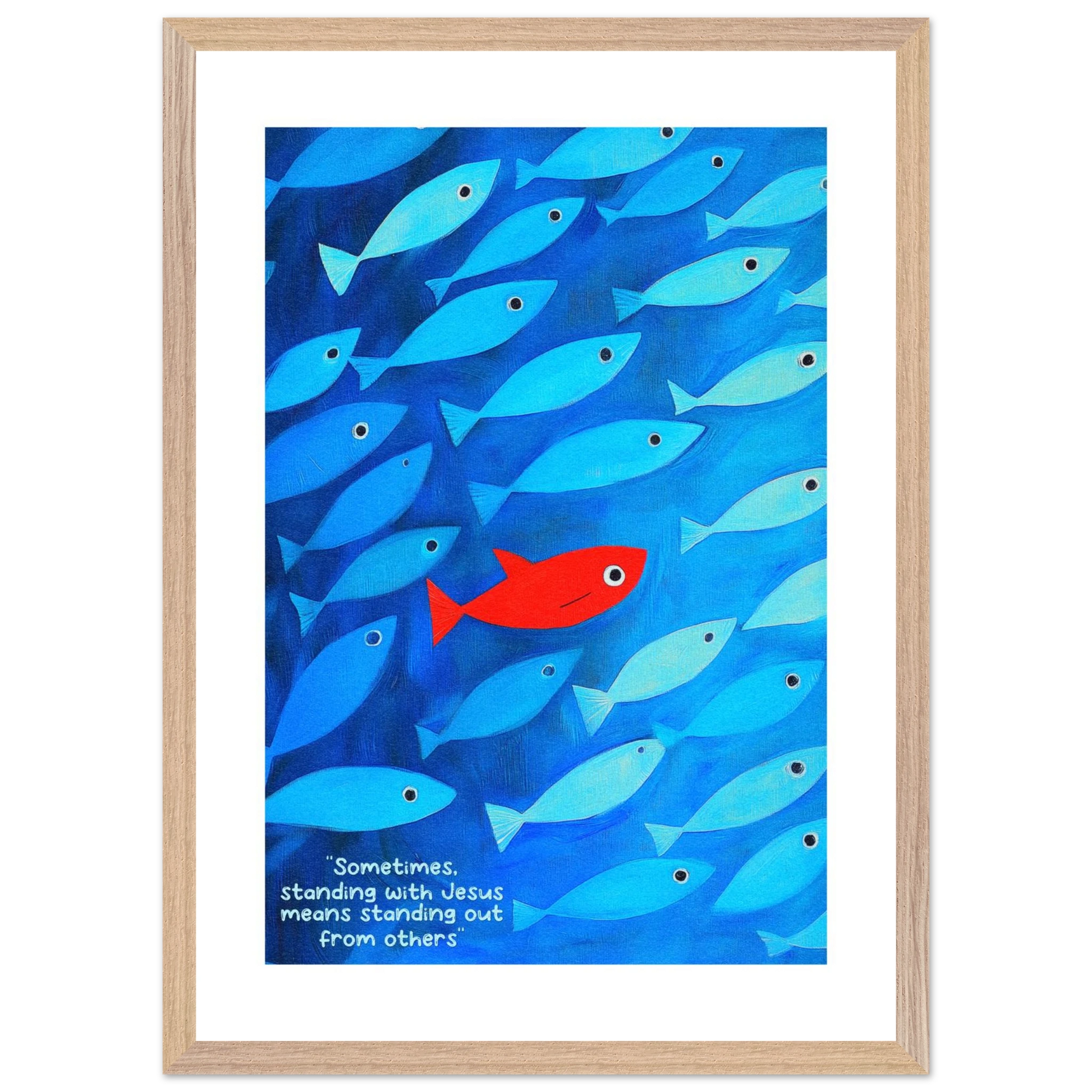 Framed wall art featuring a school of blue fish with a single red fish, and text that reads: 'Sometimes standing with Jesus means standing out from others.'.