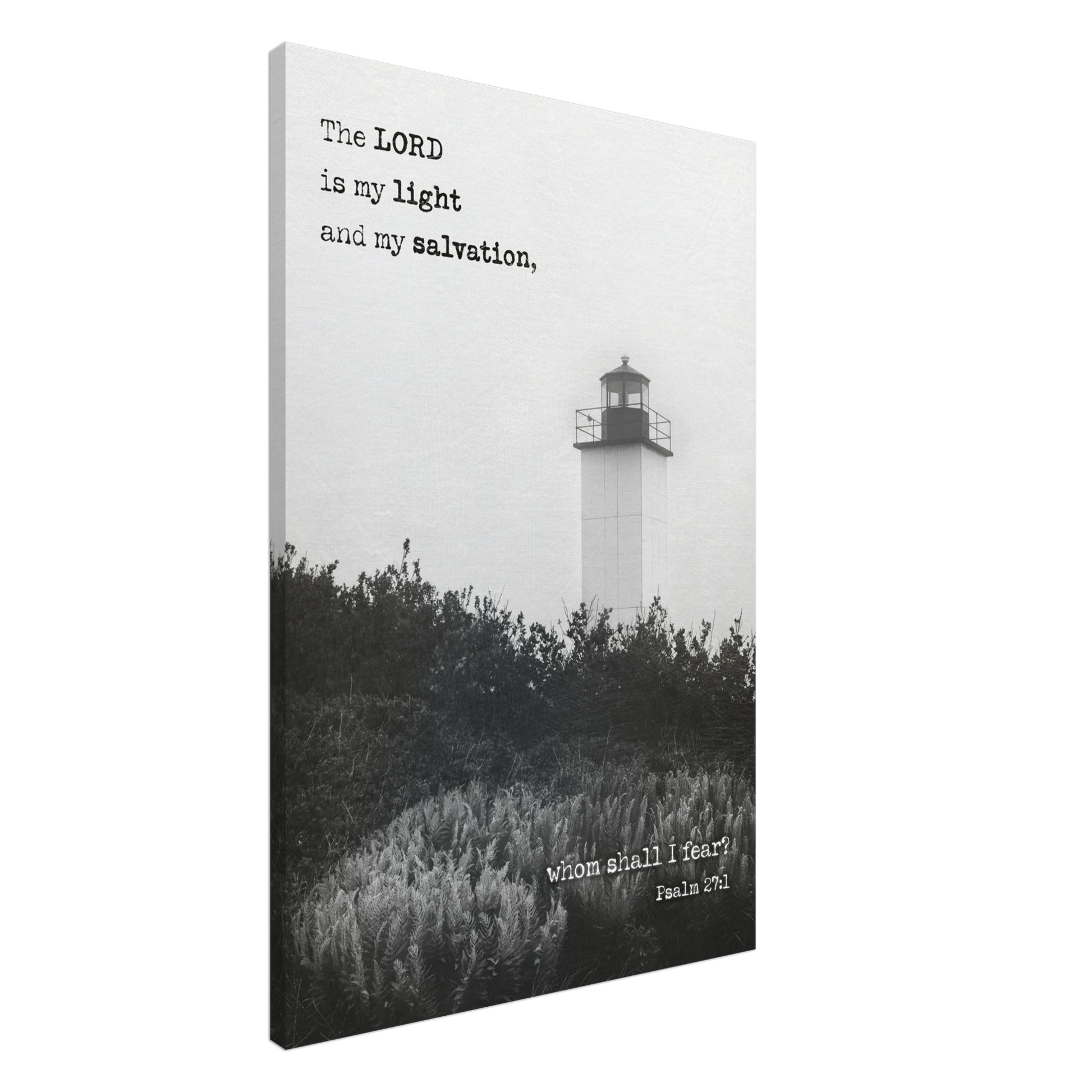 A canvas wall art print featuring a lighthouse with a black and white coastal landscape and the text of Psalm 27:1 which reads 'The Lord is my light and my salvation.'.